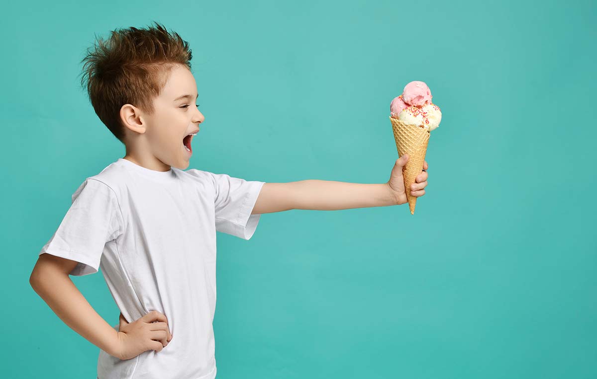 Child eating icecream indoors