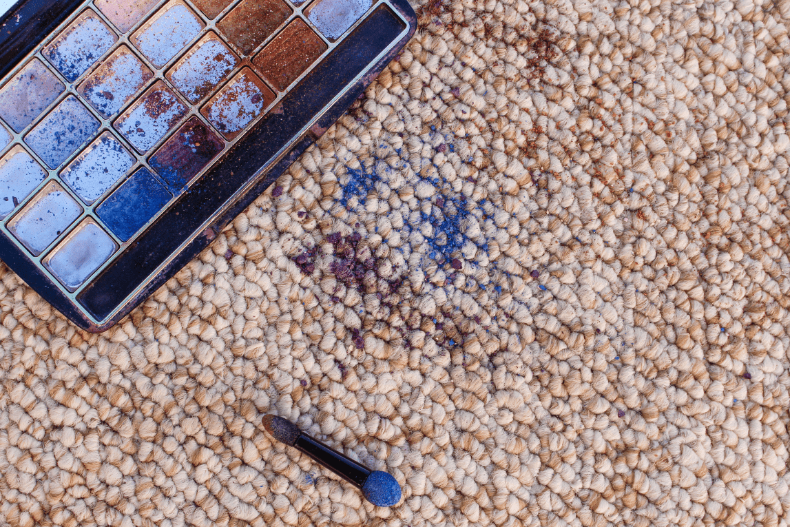 blue makeup spills on carpet